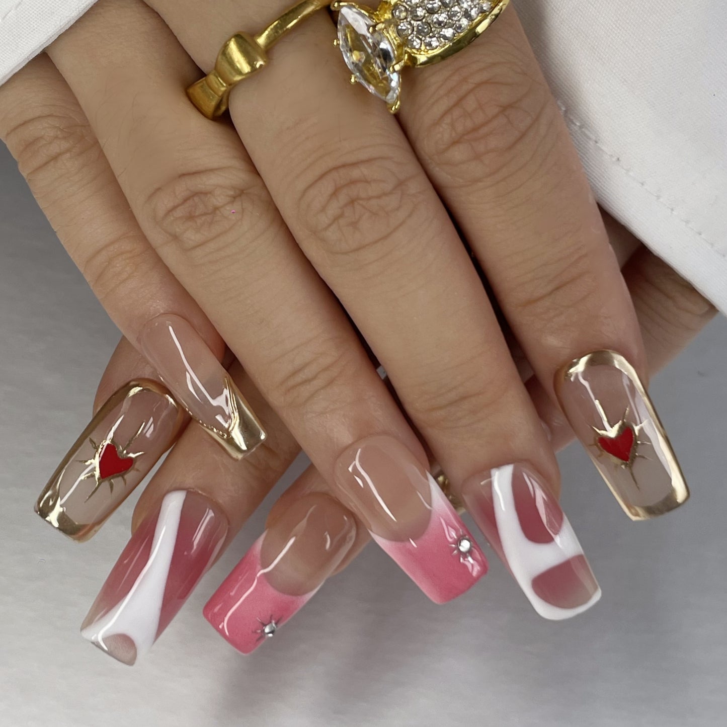 Sweet & Glam Long Nails – Gold Lines and Heart Accents(K61)