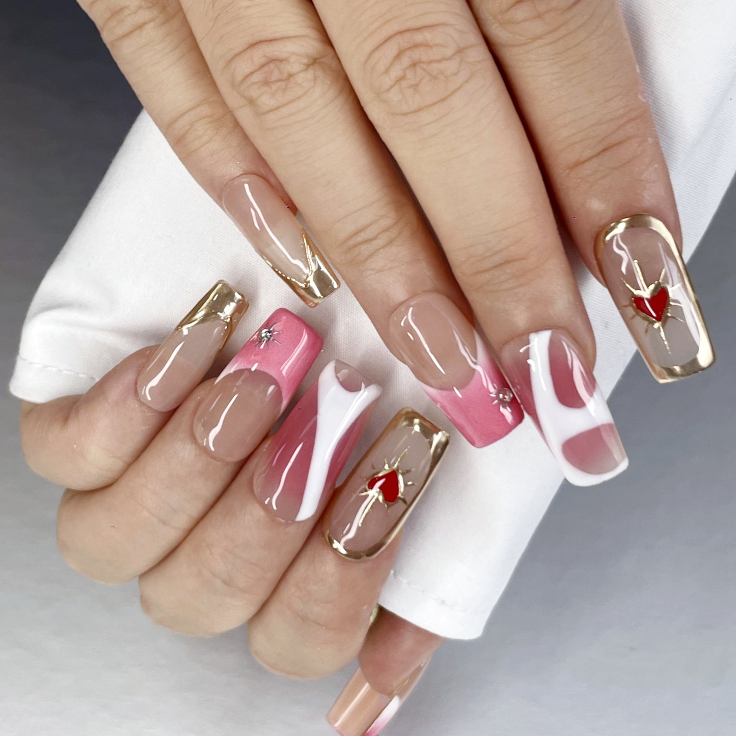 Sweet & Glam Long Nails – Gold Lines and Heart Accents(K61)