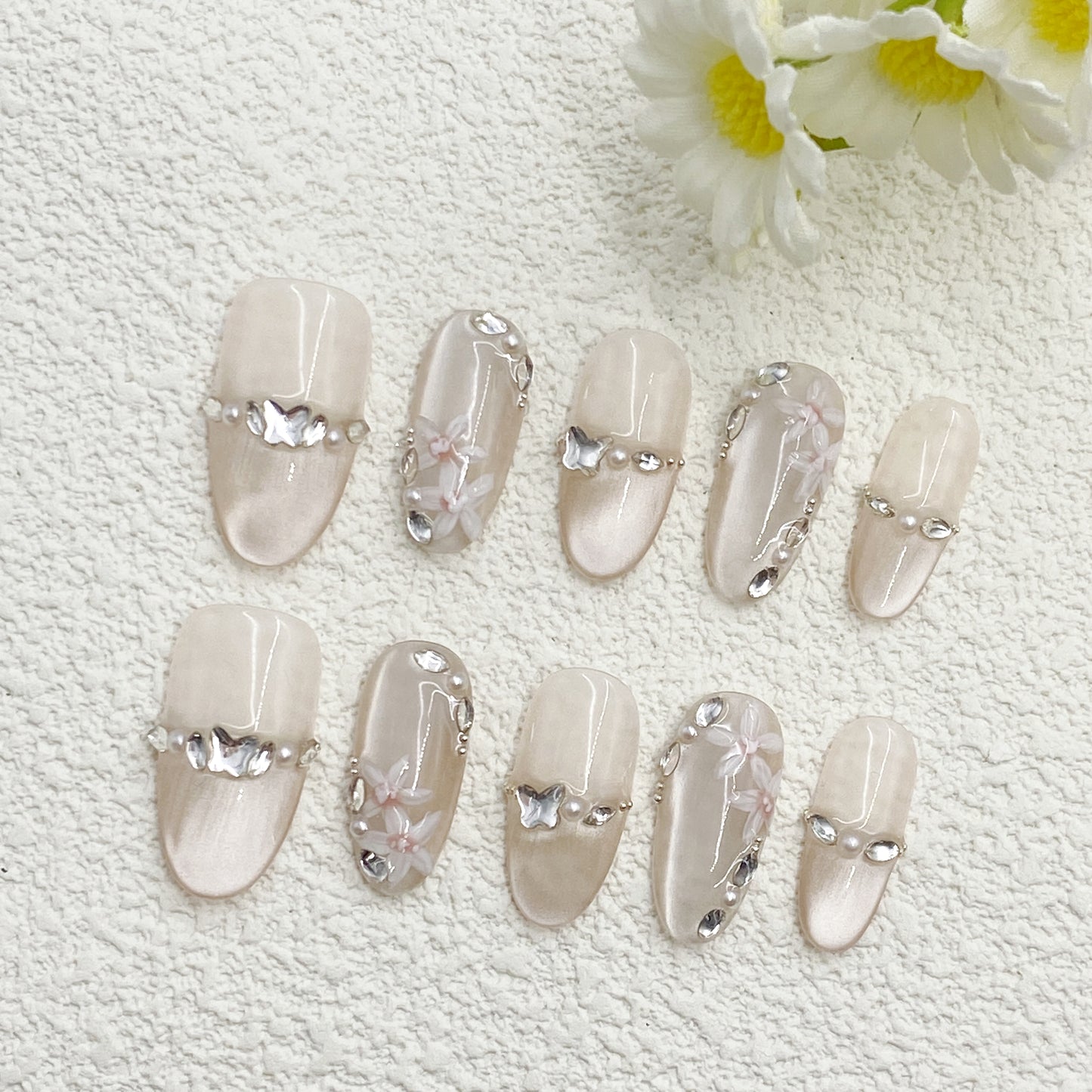 Short almond Press-On Nails – Nude Beige Cat-Eye Base with Pearls, Silver Butterflies & Clear Flowers, Soft & Elegant Handmade Set(222)